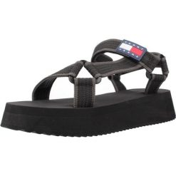 Sandały TOMMY JEANS EN0EN02747 Czarny. Czarne sandały TOMMY HILFIGER, bez wzorów, z jeansu, bez obcasa, bez zapięcia. Za 253.99 zł.