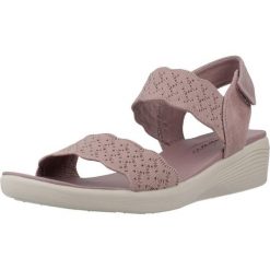 Sandały SKECHERS ARYA Fioletowy. Fioletowe sandały Skechers, bez wzorów, z tkaniny, bez obcasa, bez zapięcia. Za 215.99 zł.