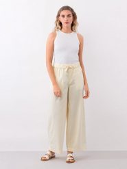IVY & OAK Spodnie w kolorze jasnożółtym rozmiar: 34. Żółte spodnie materiałowe IVY & OAK, na co dzień, bez wzorów, z materiału. Za 101.23 zł.