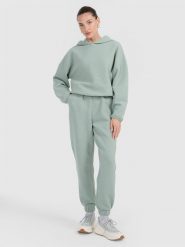 4F Spodnie dresowe z waflowej dzianiny damskie - turkusowe XS. Niebieskie spodnie dresowe 4f, xs, bez wzorów, z dresówki. Za 169.99 zł.