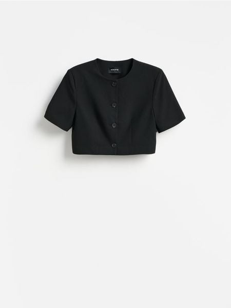 Krótki żakiet - czarny. Czarne marynarki i żakiety Reserved, l, bez wzorów, z tkaniny. Za 179.99 zł.
