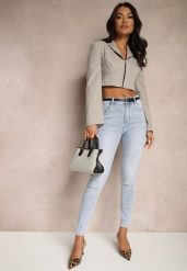 Niebieskie Jeansy o Kroju Slim High Waist Zdobione Haftem w Kształcie Serca Araniah. Niebieskie jeansy Renee, l, z aplikacjami, z podwyższonym stanem. Za 79.99 zł.