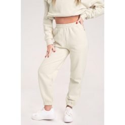 Spodnie fitness damskie Gym Glamour dresowe off. Białe spodnie dresowe GYM GLAMOUR, s, bez wzorów, z dresówki. Za 189.99 zł.