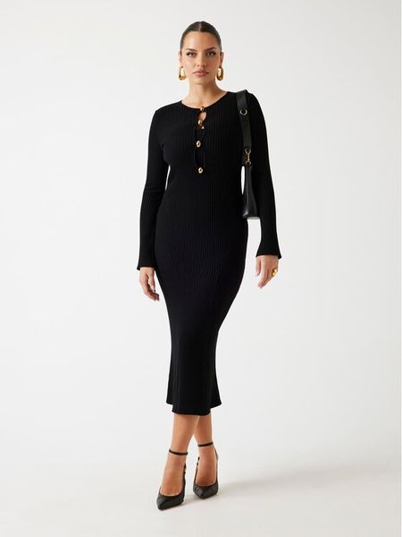 Marciano Guess Sukienka dzianinowa 5BGK55 5891Z Czarny Regular Fit. Czarne sukienki Marciano Guess, z aplikacjami, z dzianiny, bez kołnierzyka, bez ramiączek. Za 509.99 zł.