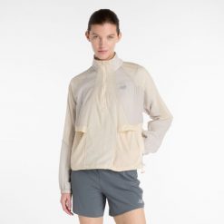 Kurtka damska New Balance WO53206LIN – beżowa. Brązowe kurtki sportowe New Balance, m, bez wzorów, z materiału, bez kaptura. Za 539.99 zł.