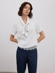 BGN Bluzka w kolorze białym rozmiar: 38. Białe bluzki BGN, bez wzorów, z koronki, bez kołnierzyka, bez ramiączek. Za 87.19 zł.