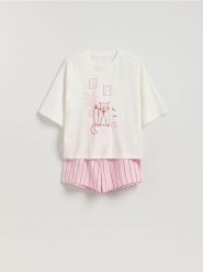 Dwuczęściowa piżama z kotem - różowy. Czerwone piżamy Reserved, bez wzorów, z bawełny, bez ramiączek. Za 99.99 zł.