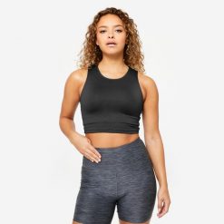 Koszulka fitness damska Domyos bez rękawów crop top. Czarne koszulki sportowe DOMYOS, bez wzorów, z elastanu, bez ramiączek, na fitness i siłownię. Za 34.99 zł.
