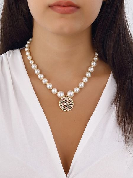 Nakkash Pozłacany naszyjnik "Flower of Life" z cyrkoniami i masą perłową rozmiar: onesize. Białe naszyjniki Nakkash, z cyrkonią, metalowe. Za 61.17 zł.