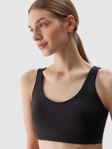 4F Biustonosz treningowy ze średnim wsparciem damski - czarny XS. Czarne bielizna sportowa 4f, s, bez wzorów, z dzianiny. W wyprzedaży za 69.99 zł.