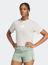 Adidas Koszulka w kolorze kremowym rozmiar: M. Brązowe bluzki Adidas, m, bez wzorów, bez kołnierzyka, bez ramiączek. Za 96.60 zł.