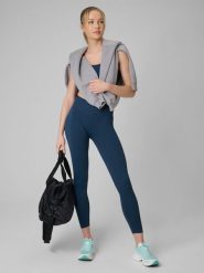 4F Legginsy treningowe bezszwowe damskie - turkusowe XS/S. Niebieskie legginsy 4f, l, bez wzorów, ze skóry, z podwyższonym stanem, długie. Za 129.99 zł.