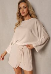 Beżowe Szorty z Gumką w Talii i Lampasami z Falbanką o Asymetrycznym Wykończeniu Laventa. Brązowe szorty Renee, bez wzorów, eleganckie. Za 59.99 zł.