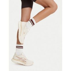 Buty na siłownię Reebok. Białe obuwie sportowe Reebok, bez zapięcia, na fitness i siłownię. Za 399.99 zł.