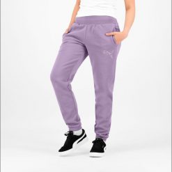 Spodnie dresowe damskie Puma Gym & Pilates. Fioletowe spodnie dresowe Puma, s, bez wzorów, z bawełny, na fitness i siłownię. W wyprzedaży za 89.99 zł.