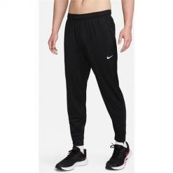 Spodnie sportowe damskie Nike Totality. Czarne spodnie dresowe Nike, m, bez wzorów, z dresówki. Za 413.00 zł.