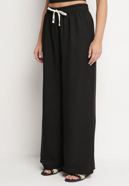 Czarne Szerokie Spodnie z Bawełną i Wysokim Stanem Ozdobione Wiązaniem Laveldi. Czarne spodnie materiałowe Born2be, na co dzień, l, bez wzorów, z bawełny, z podwyższonym stanem. Za 39.99 zł.