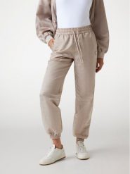 Guess Spodnie materiałowe 177277 Beżowy Slim Fit. Brązowe spodnie materiałowe Guess, xxs, z aplikacjami, z materiału. Za 435.00 zł.