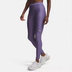 Legginsy treningowe damskie Under Armour HeatGear. Fioletowe legginsy Under Armour, bez wzorów, na fitness i siłownię. Za 129.99 zł.