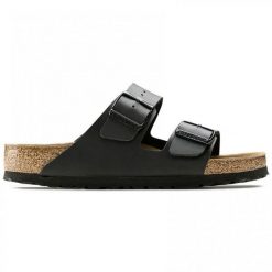 Kapcie Birkenstock Arizona Czarny Dorosłych. Brązowe obuwie domowe Birkenstock, bez wzorów, z gumy, bez zapięcia. Za 380.66 zł.
