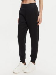 Guess Spodnie dresowe W5YB11 KBYE2 Czarny Regular Fit. Czarne spodnie dresowe Guess, s, z aplikacjami, z dresówki. Za 279.99 zł.