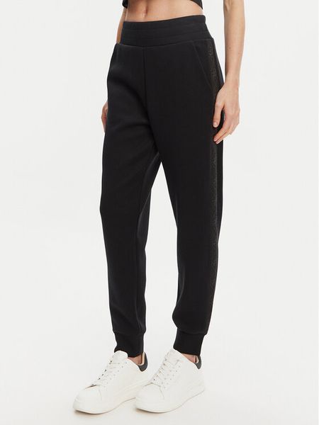 Guess Spodnie dresowe W5YB11 KBYE2 Czarny Regular Fit. Czarne spodnie dresowe Guess, xs, z aplikacjami, z dresówki. Za 359.99 zł.