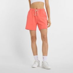 Spodenki damskie New Balance WS41508DTR – pomarańczowe. Brązowe szorty New Balance, bez wzorów, z bawełny, klasyczne, z podwyższonym stanem. Za 199.99 zł.