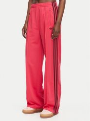 Adidas Spodnie dresowe Firebird Loose Tracksuit KW0228 Różowy Loose Fit. Czerwone spodnie dresowe Adidas, s, bez wzorów, z dresówki. Za 299.99 zł.
