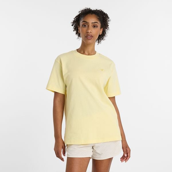 Koszulka damska New Balance WT41501PRC – żółta. Żółte bluzki New Balance, s, bez wzorów, z materiału, eleganckie, bez kołnierzyka, bez ramiączek. Za 99.99 zł.