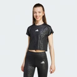 Koszulka All Sports Animal Print Crop. Białe bluzki Adidas, bez wzorów, sportowe, bez kołnierzyka, bez ramiączek. W wyprzedaży za 77.35 zł.