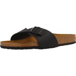 Klapki damskie Birkenstock 040793. Brązowe klapki Birkenstock, bez wzorów, z materiału, bez obcasa. Za 553.00 zł.