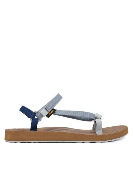 Teva Sandały Original Universal Slim 1150110 Niebieski. Niebieskie sandały Teva, bez wzorów, z materiału, bez obcasa, na płaskiej podeszwie, bez zapięcia. Za 201.99 zł.