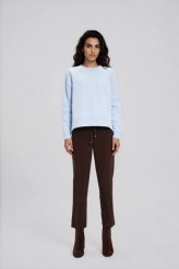 Gładka bluza błękitna. Niebieskie bluzy MOODO, l, bez wzorów, z bawełny, bez kaptura. Za 89.99 zł.