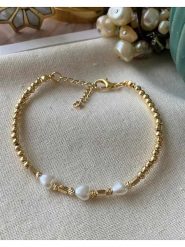 Luseera Pozłacana bransoletka rozmiar: onesize. Białe bransoletki Luseera, z perłą, pozłacane. Za 34.99 zł.