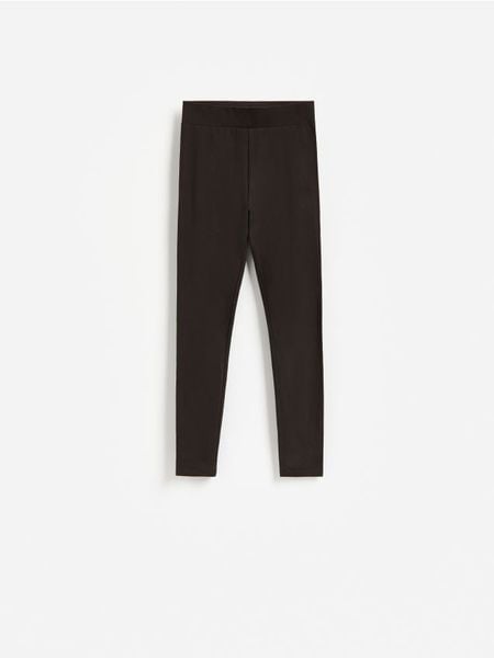 Legginsy z bawełną - ciemnobrązowy. Brązowe legginsy Reserved, l, bez wzorów, z bawełny. Za 39.99 zł.