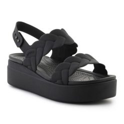 Sandały Crocs Brooklyn Woven Low Wedge 209977-060 czarne. Czarne sandały bez wzorów, klasyczne, bez obcasa, na koturnie, bez zapięcia. Za 367.32 zł.