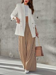 Milan Kiss Spodnie w kolorze kremowo-brązowym rozmiar: XL. Brązowe spodnie materiałowe Milan Kiss, xl, bez wzorów, z bawełny, z podwyższonym stanem. Za 165.99 zł.