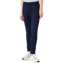 Spodnie damskie Champion Slim Pants. Niebieskie spodnie materiałowe Champion, na co dzień, bez wzorów, z bawełny. Za 154.99 zł.