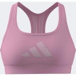 Stanik sportowy ADIDAS. Czerwone koszulki sportowe Adidas, bez wzorów, z materiału, bez ramiączek, na fitness i siłownię. Za 129.99 zł.