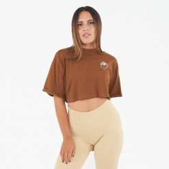 Koszulka crop top damska COSMIC LOVE brązowa. Brązowe bluzki LEGEA, bez wzorów, z bawełny, sportowe, bez kołnierzyka, bez ramiączek. Za 52.00 zł.