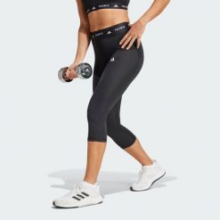 Legginsy capri TECHFIT. Czarne legginsy Adidas, xs, bez wzorów, z materiału. Za 179.00 zł.