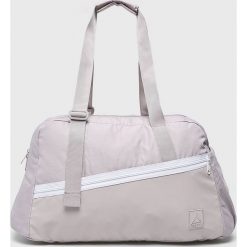 Reebok - Torba. Fioletowe torby na ramię Reebok, bez wzorów, z materiału, sportowe, na ramię, bez dodatków. W wyprzedaży za 139.90 zł.