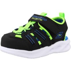 Sandały SKECHERS 407033N Czarny. Czarne sandały Skechers, bez wzorów, z materiału, bez obcasa, bez zapięcia. Za 156.99 zł.
