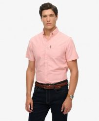 Superdry Koszula Oxford krótki rękaw Rose Pink Chambray z bawełny organicznej. Czerwone koszule Superdry, l, bez wzorów, z bawełny, klasyczne, bez kołnierzyka, bez ramiączek. Za 335.65 zł.