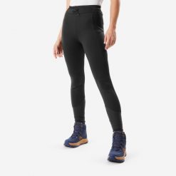 Legginsy turystyczne damskie Quechua NH500 Warm. Czarne legginsy QUECHUA, m, bez wzorów, z materiału. Za 199.99 zł.