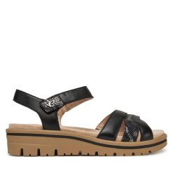 Sandały Caprice. Czarne sandały Caprice, bez wzorów, bez obcasa, na koturnie, bez zapięcia. Za 249.99 zł.