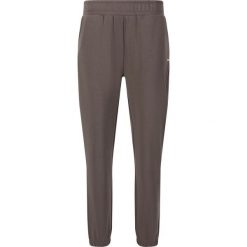 Damskie spodnie dresowe Athlecia Jillnana V2. Czarne spodnie dresowe Athlecia, bez wzorów, z dresówki. Za 239.50 zł.