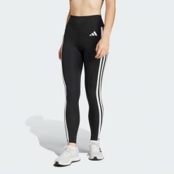 Legginsy Optime Essentials 3-Stripes 7/8. Białe legginsy Adidas, bez wzorów, z materiału. W wyprzedaży za 198.70 zł.