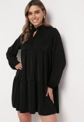 Czarna Rozkloszowana Sukienka z Falbanką Uxaria. Czarne sukienki Born2be, uniwersalny, z aplikacjami, eleganckie, bez kołnierzyka, bez ramiączek, mini, rozkloszowane. Za 89.99 zł.