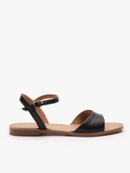 Czarne płaskie sandały. Czarne sandały Ryłko, bez wzorów, z syntetyku, eleganckie, z okrągłym noskiem, bez obcasa, na płaskiej podeszwie, bez zapięcia. Za 299.99 zł.